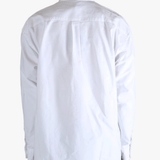White shirt worn by a person, showing the shirt's fit