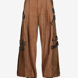 Brown pant worn by a person, showing the pant’s fit