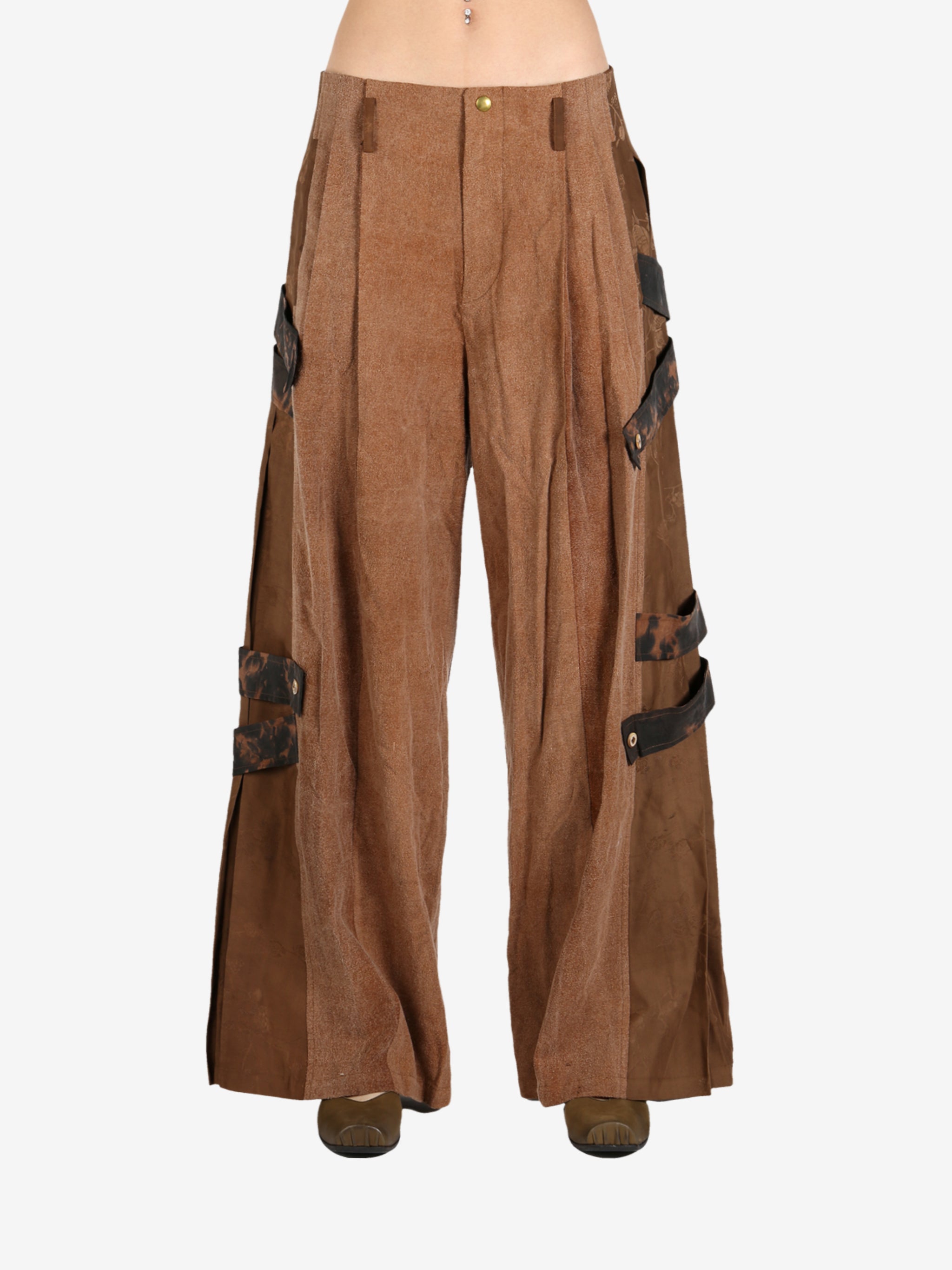 Brown pant worn by a person, showing the pant’s fit