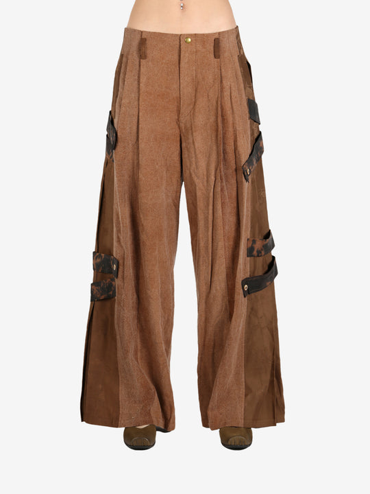 Brown pant worn by a person, showing the pant’s fit