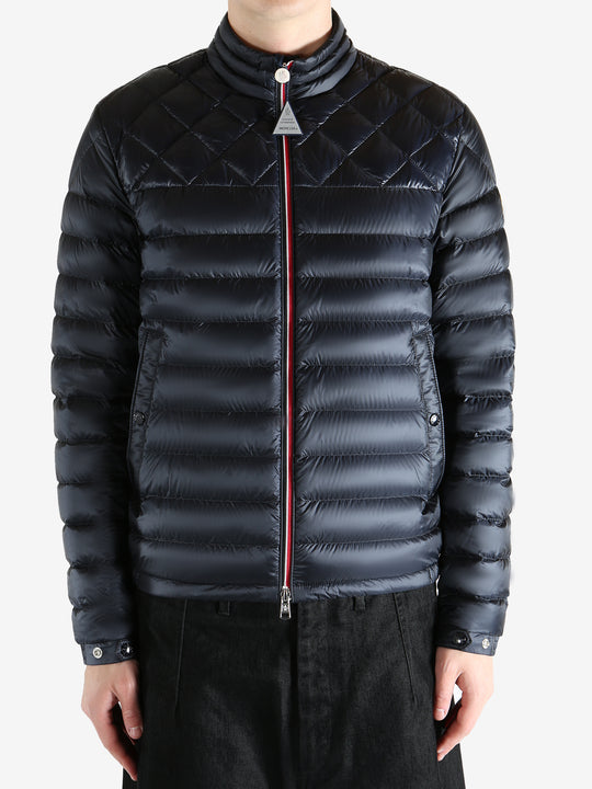 Black jacket worn by a person, showing the jacket fit