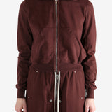 Burgundy hoodies worn by a person, showing the hoodies fit