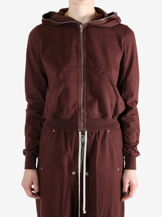 Burgundy hoodies worn by a person, showing the hoodies fit