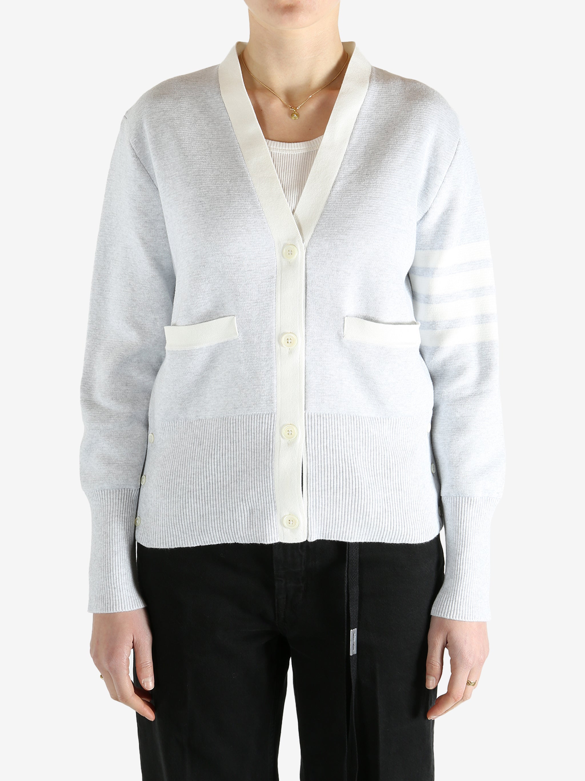 Gray cardigan worn by a person, showing the cardigan fit