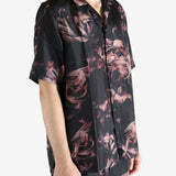 Black shirt worn by a person, showing the shirt's fit