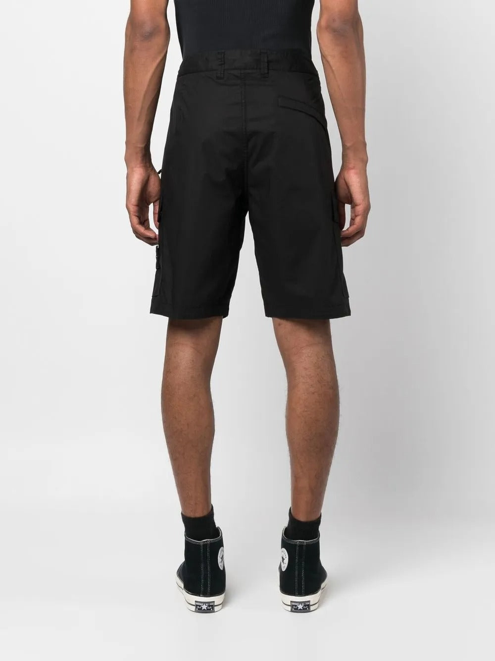 Black shorts worn by a person, showing the shorts fit