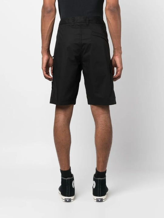Black shorts worn by a person, showing the shorts fit