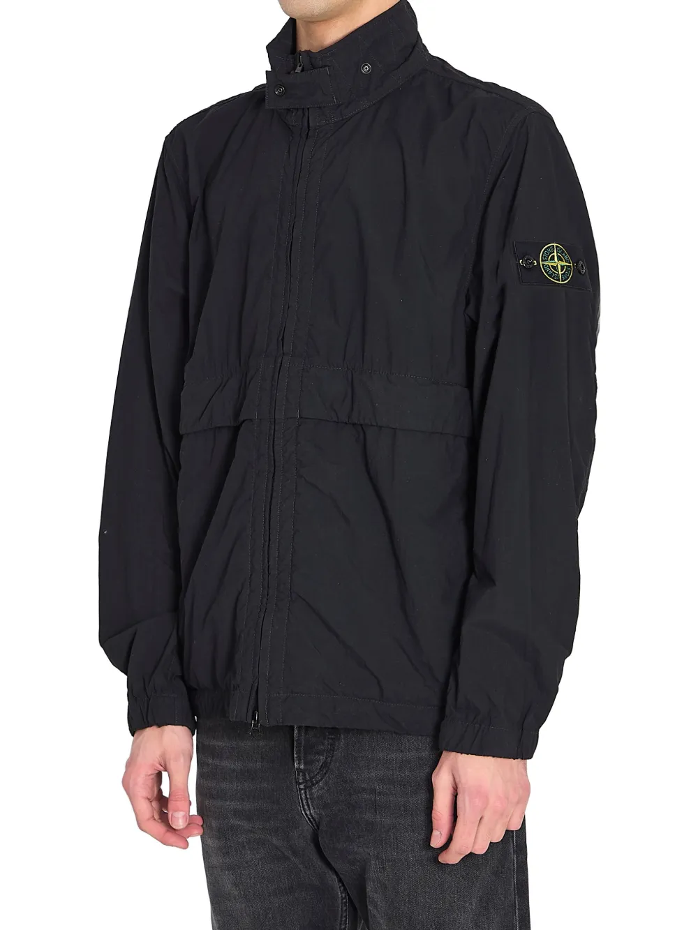 Black jacket worn by a person, showing the black jacket's fit
