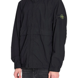 Black jacket worn by a person, showing the black jacket's fit