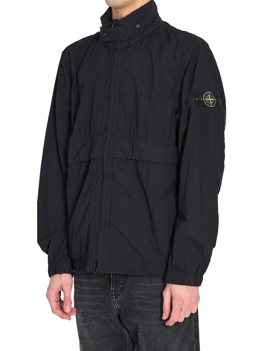Black jacket worn by a person, showing the black jacket's fit
