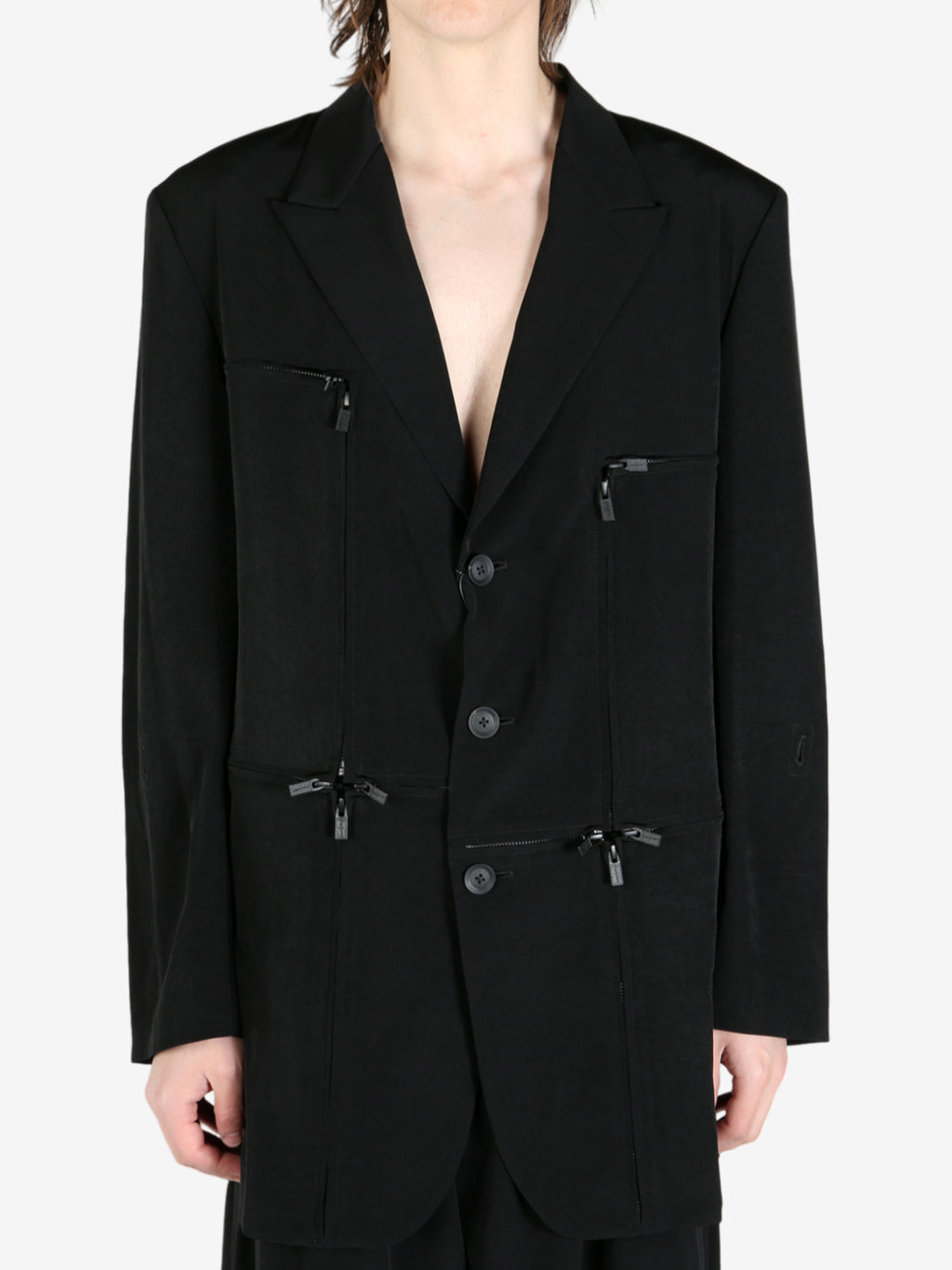 Black jacket worn by a person, showing the jacket's fit