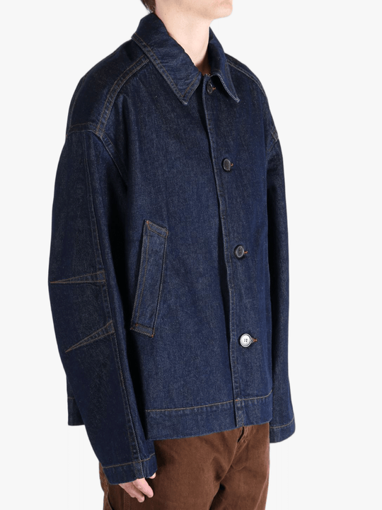 Navy jacket worn by a person, showing the jacket's fit