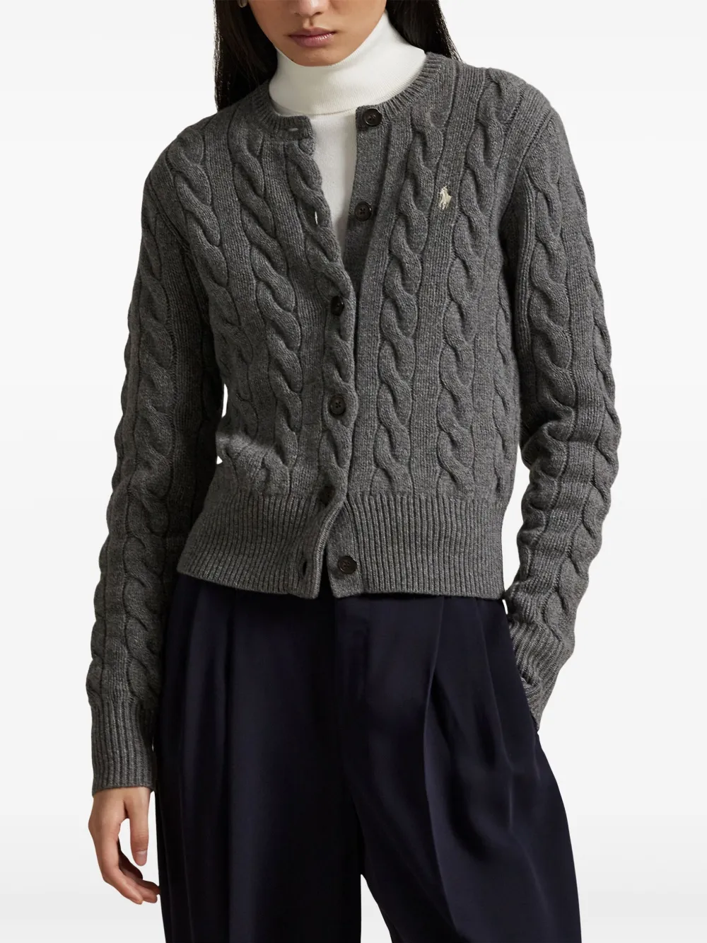 Grey kintwear worn by a person, showing the knitwear's fit