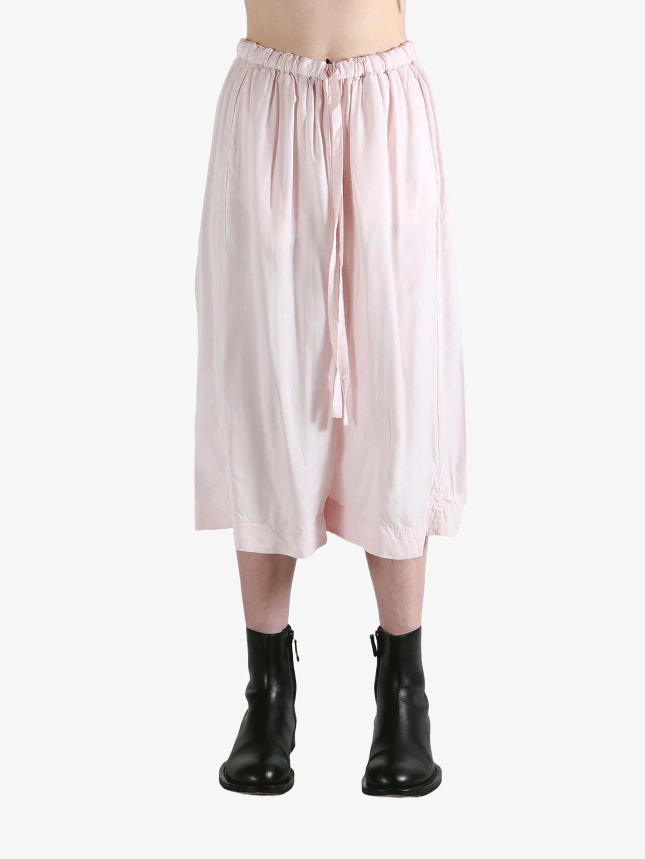 Pink pants worn by a person, showing the pants fit