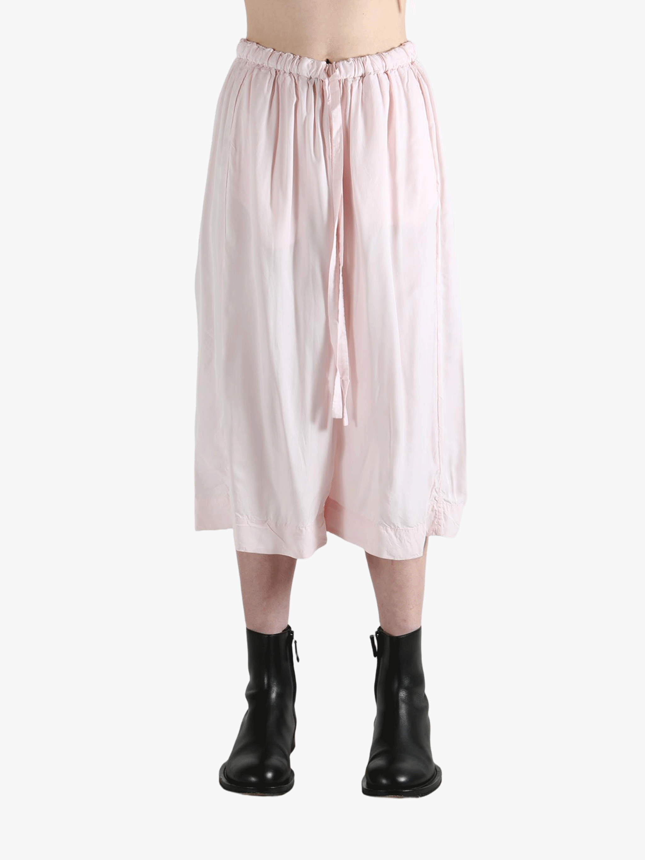 Pink pants worn by a person, showing the pants fit