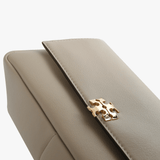 Close up of tan bags, showing texture of the fabric