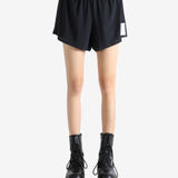 Black shorts worn by a person, showing the shorts' fit