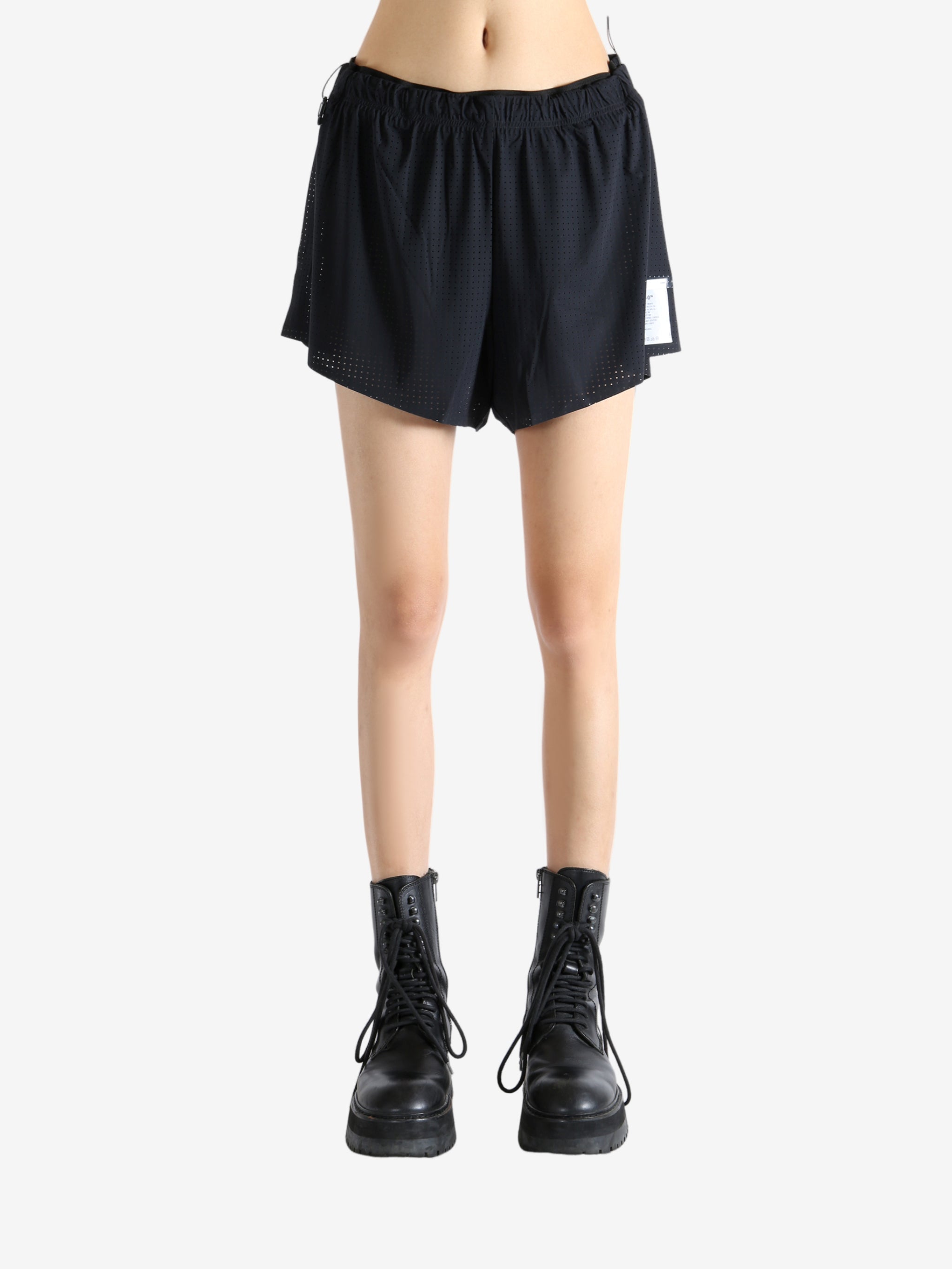 Black shorts worn by a person, showing the shorts' fit