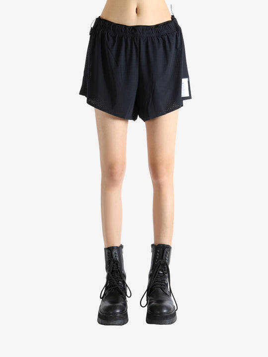 Black shorts worn by a person, showing the shorts' fit