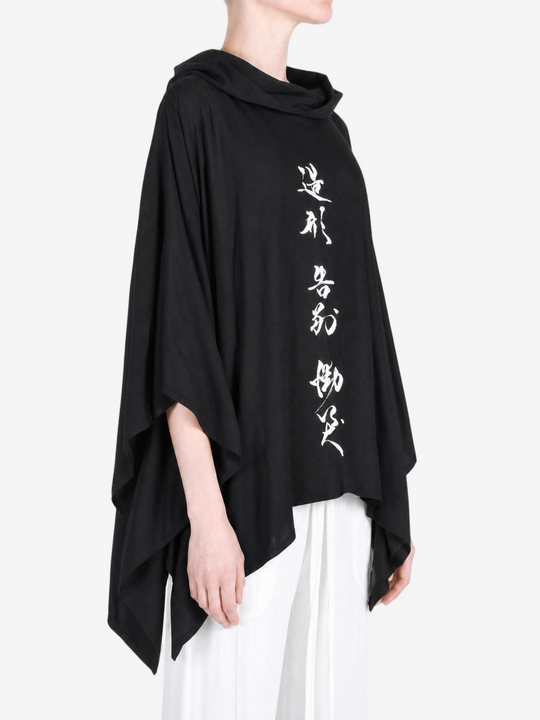 Black dress worn by a person, showing the dress fit