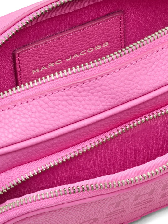 Close up of pink bag, showing texture of the leather fabric