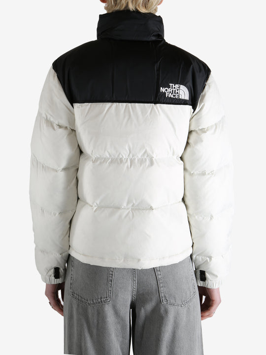  white jacket worn by a person, showing the jacket  fit