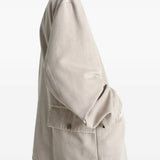 White shirt worn by a person, showing the shirt's fit