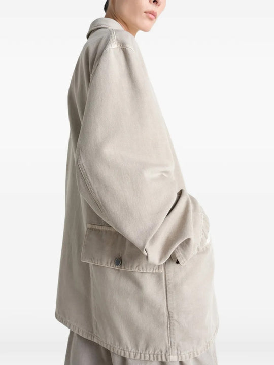 White shirt worn by a person, showing the shirt's fit