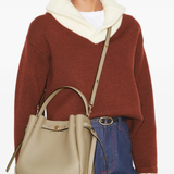 Brown bag worn by a person, showing the bag's fit