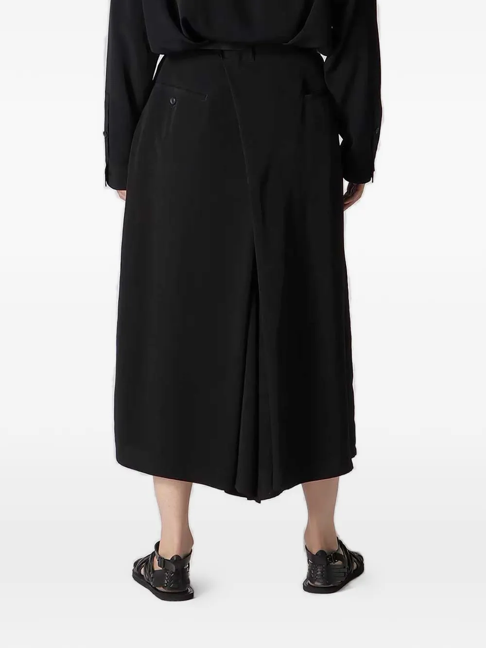 black pants,worn by a person, showing the pants fit