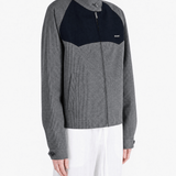 Grey jacket worn by a person, showing the jacket fit
