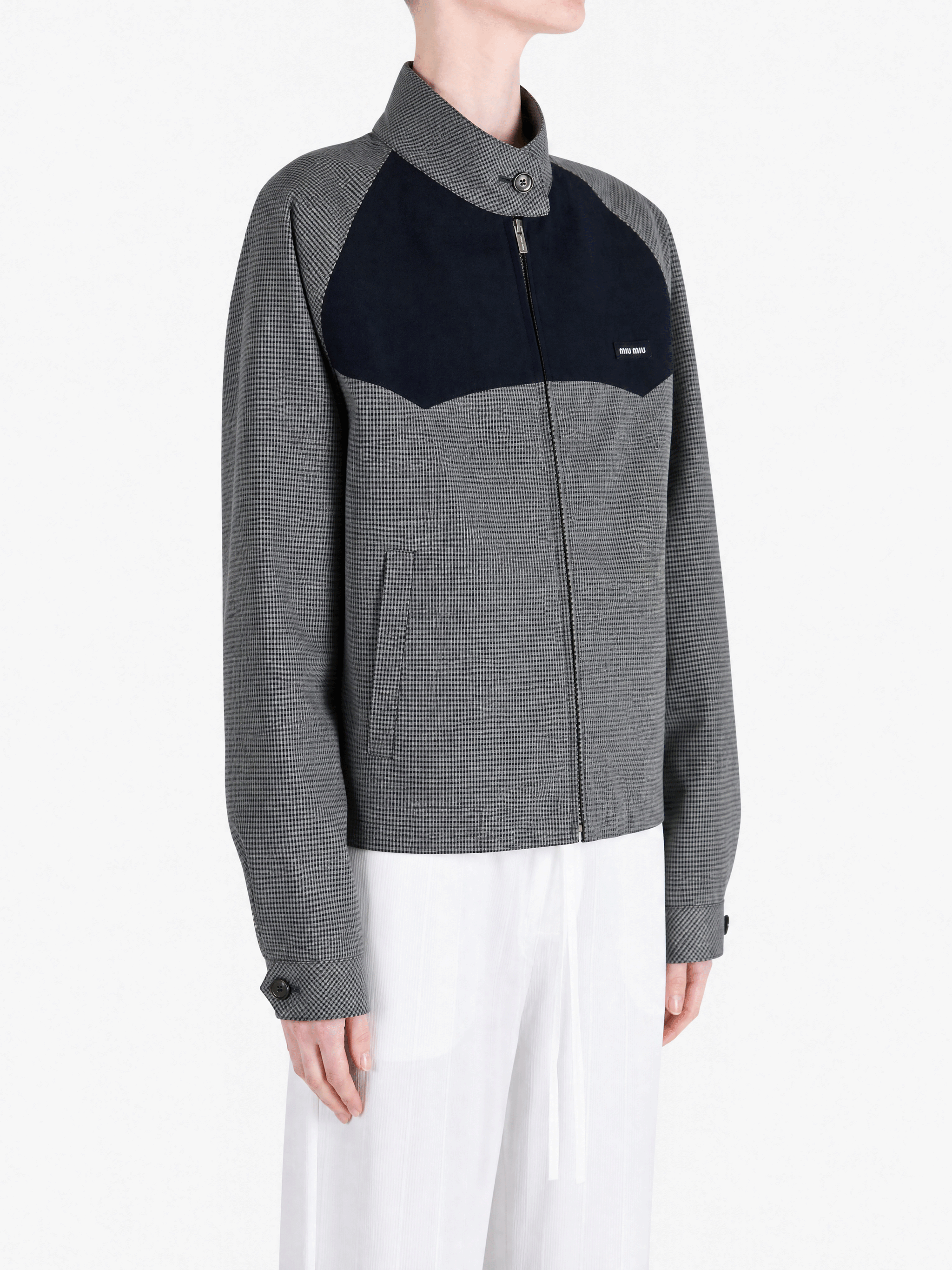 Grey jacket worn by a person, showing the jacket fit