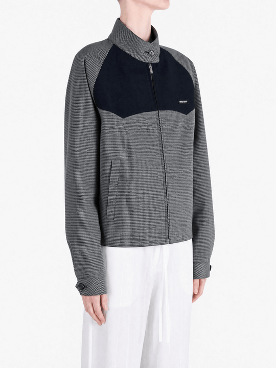 Grey jacket worn by a person, showing the jacket fit