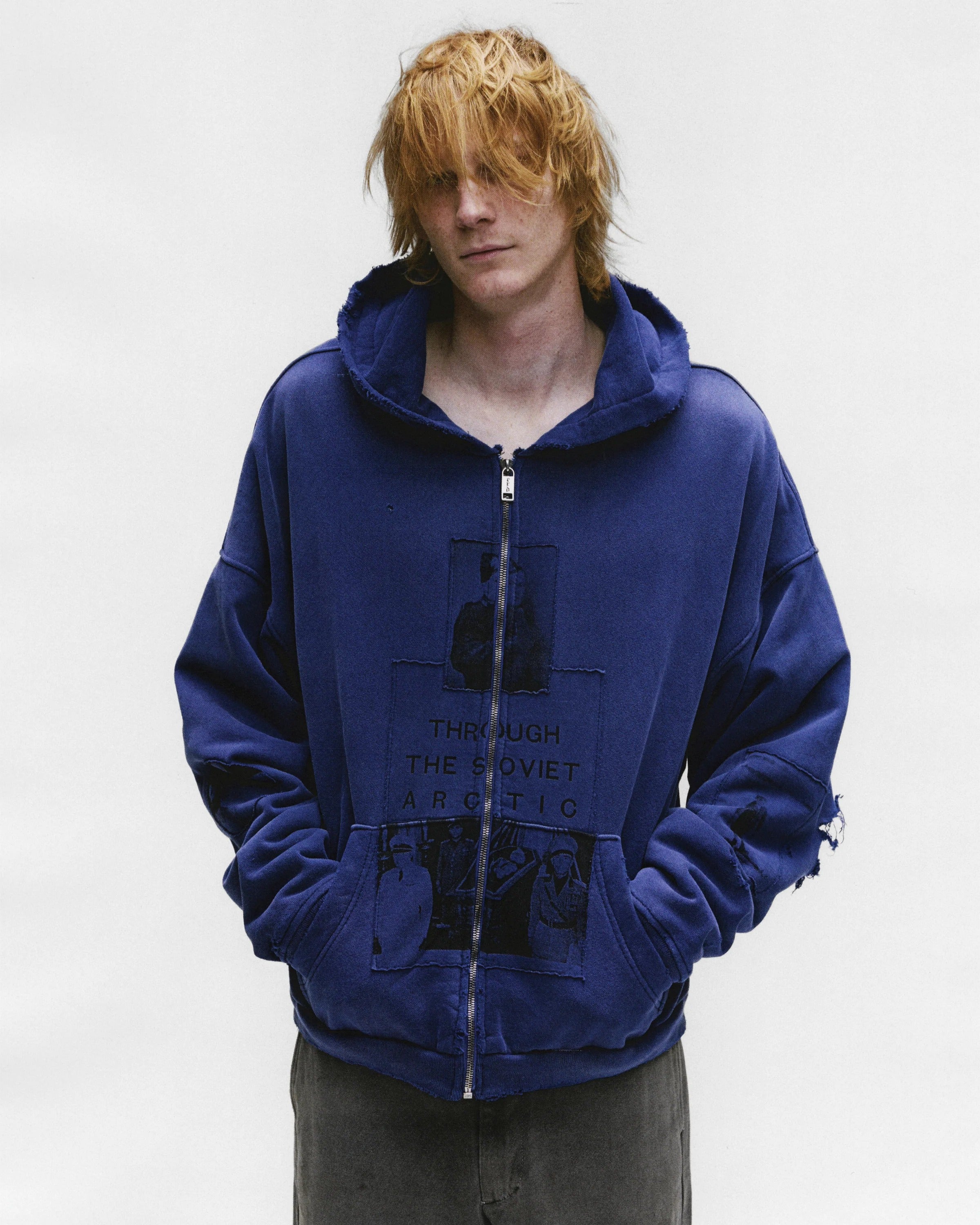 Blue hoodie worn by a person, showing the hoodie's fit