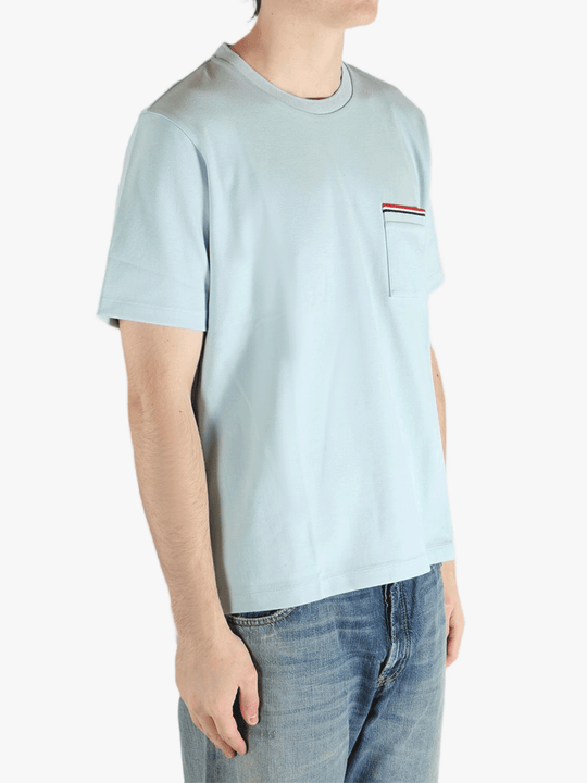 Blue t-shirt worn by a person, showing the t-shirt fit