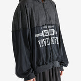 Black sweater worn by a person, showing the sweater's fit