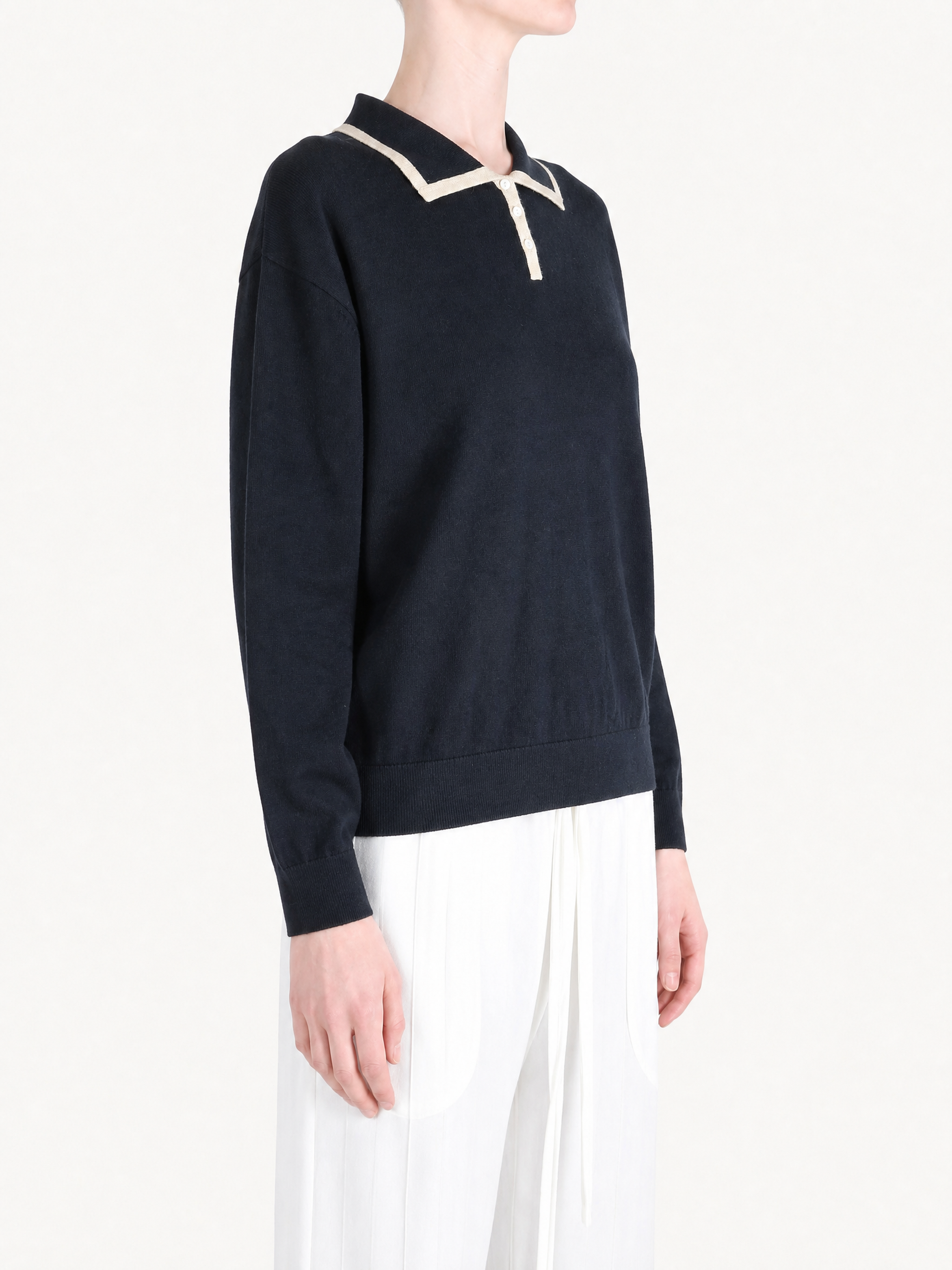 Navy shirt worn by a person, showing the shirt fit