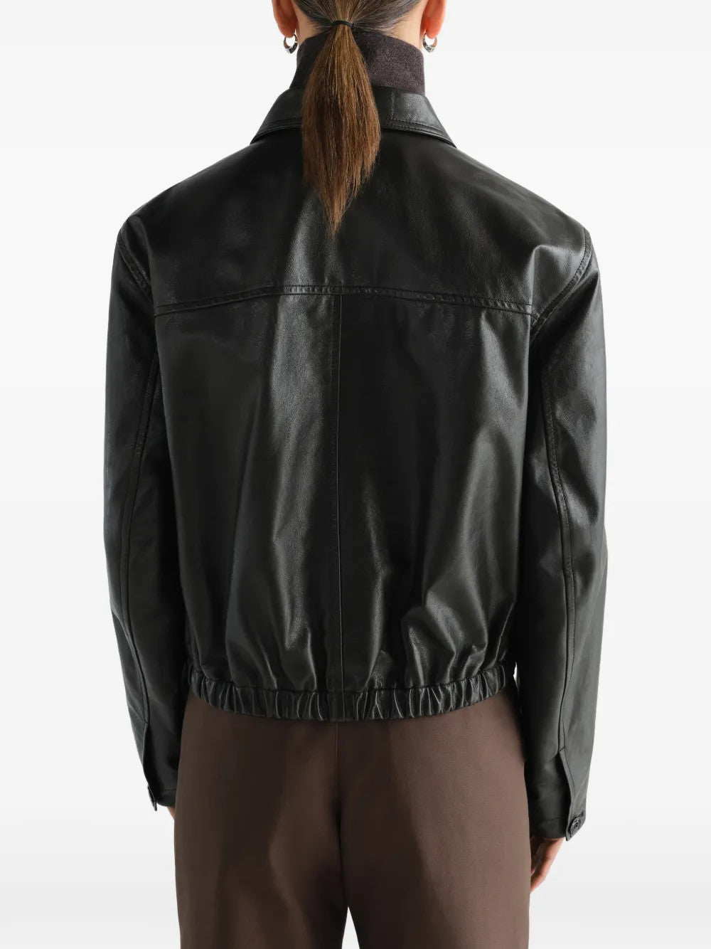 Black jacket worn by a person, showing the jacket fit