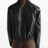 Black jacket worn by a person, showing the jacket fit
