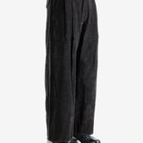 Brown pants worn by a person, showing the pants' fit