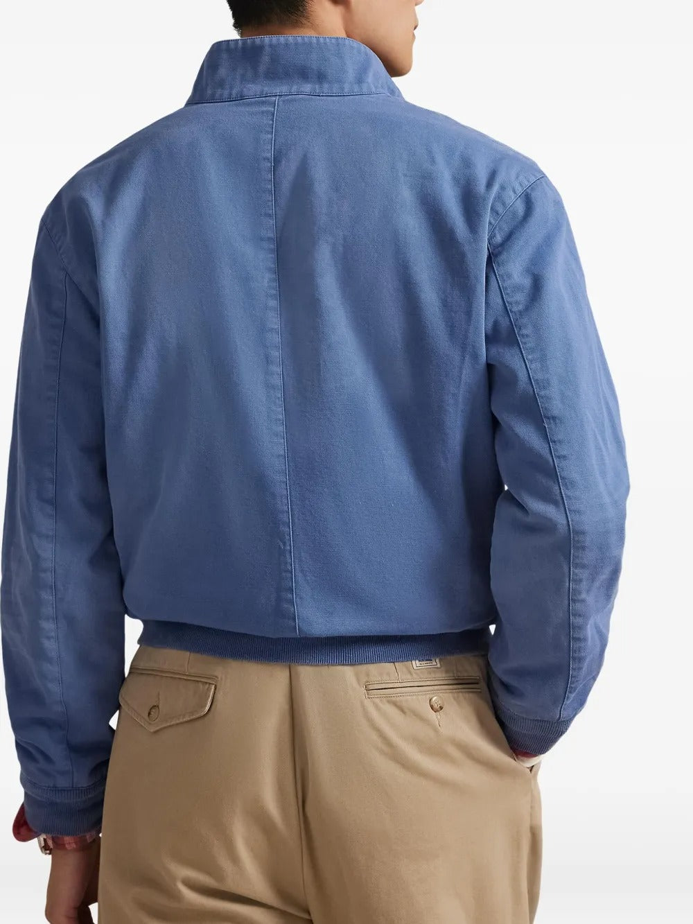 Blue jacket worn by a person, showing the jacket's fit