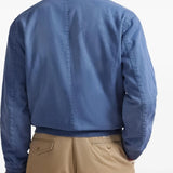 Blue jacket worn by a person, showing the jacket's fit