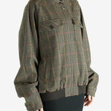 Brown jacket worn by a person, showing the jacket's fit