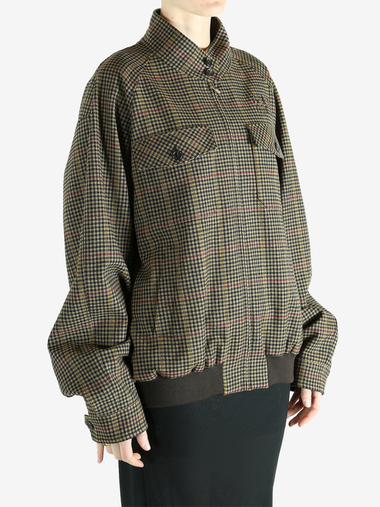 Brown jacket worn by a person, showing the jacket's fit