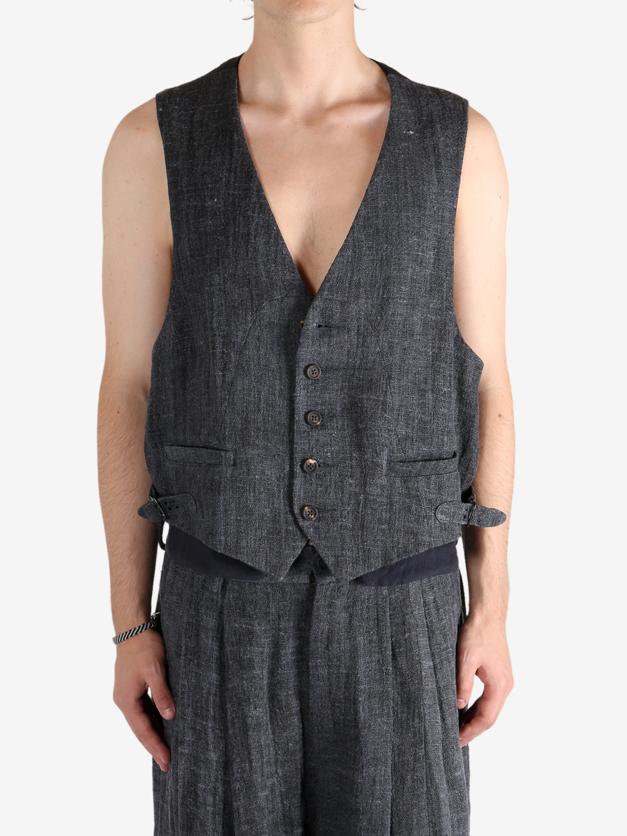 Grey waistcoat worn by a person, showing the waistcoat fit