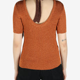 Orange T-shirt worn by a person, showing the T-shirt's fit