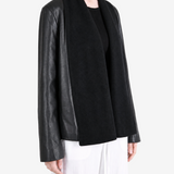 Black jacket worn by a person, showing the jacket fit