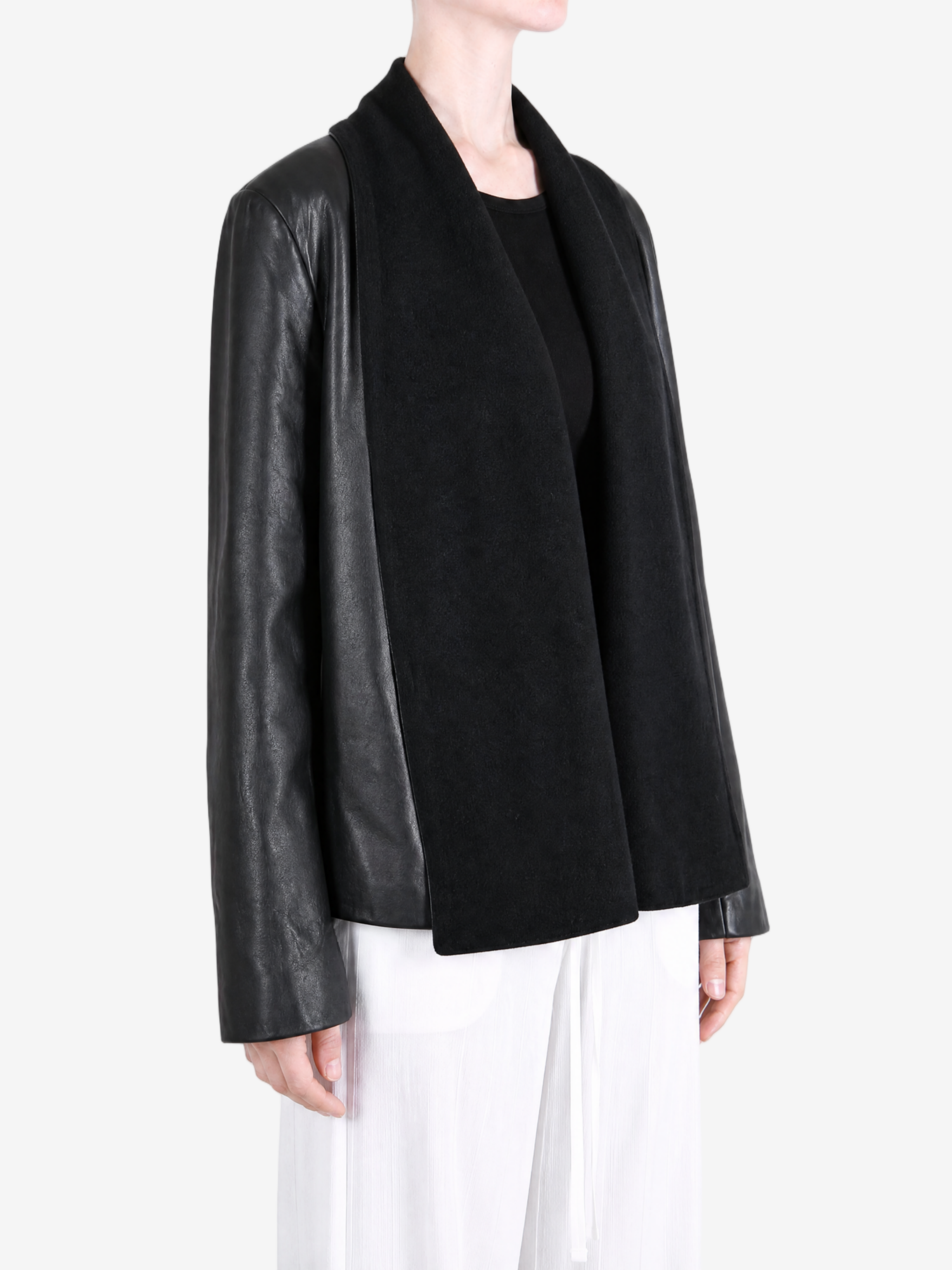 Black jacket worn by a person, showing the jacket fit