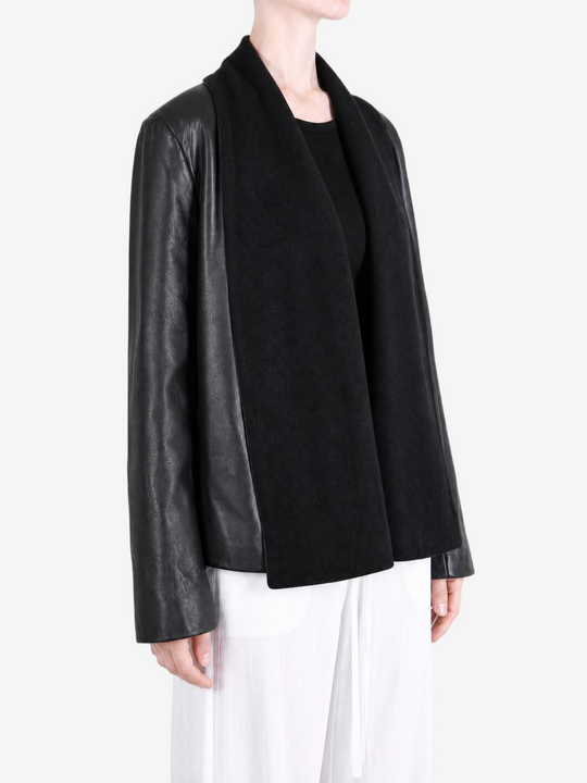 Black jacket worn by a person, showing the jacket fit