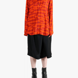 Red shirt worn by a person, showing the shirt's view